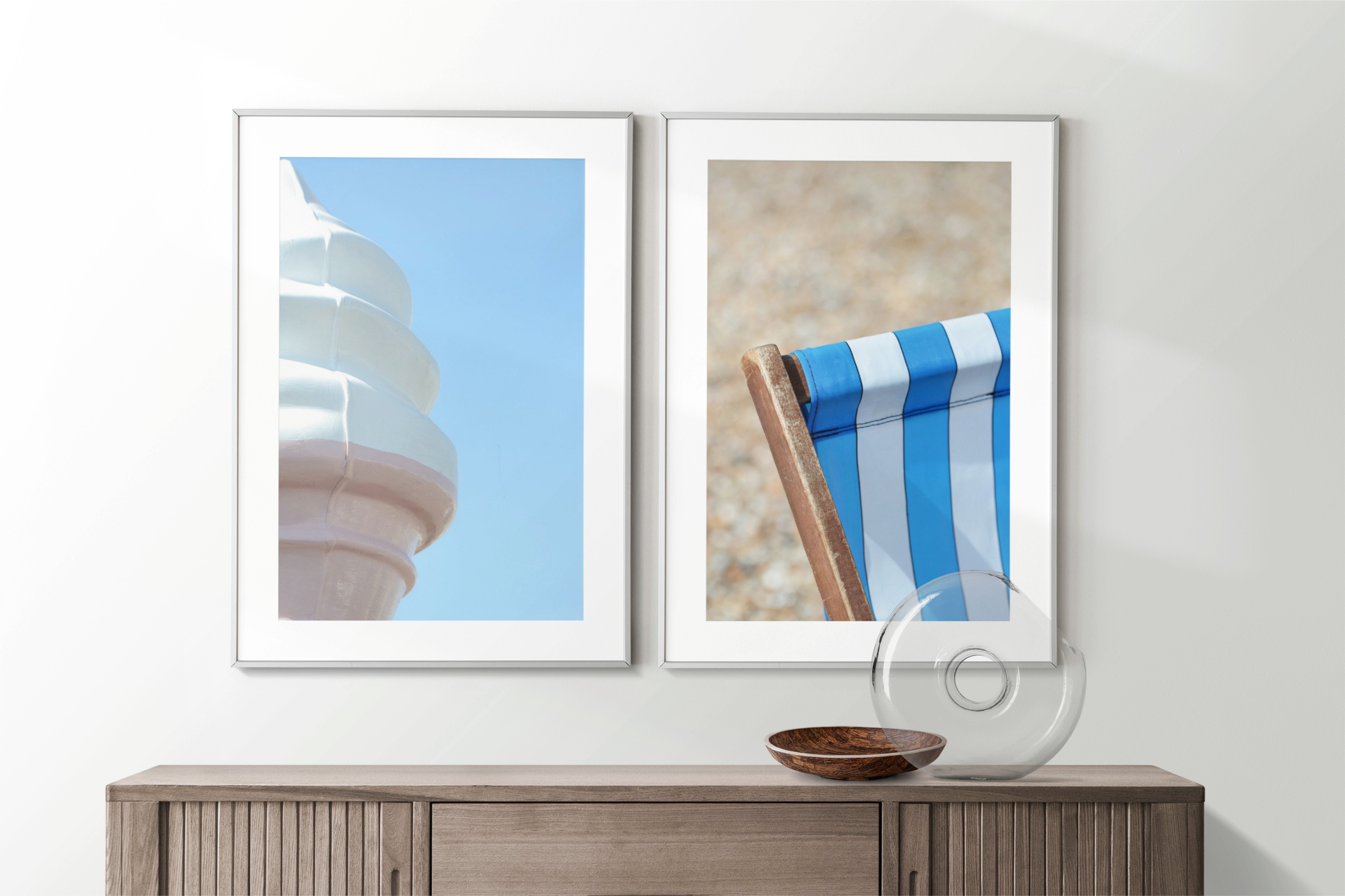 Two framed prints connected by subject matter — ice cream cone and striped deckchair evoking the British seaside
